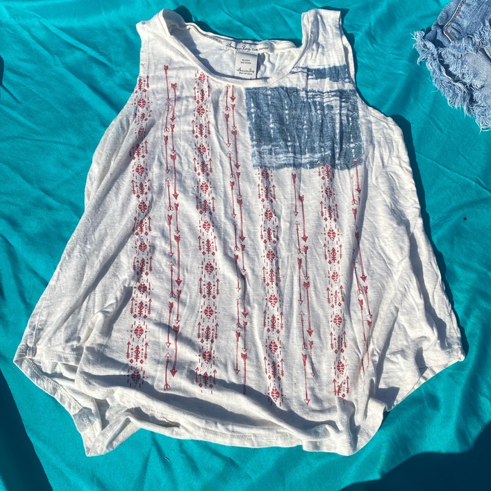 American flag tank top, size L, white with red bow and arrows for the stripes